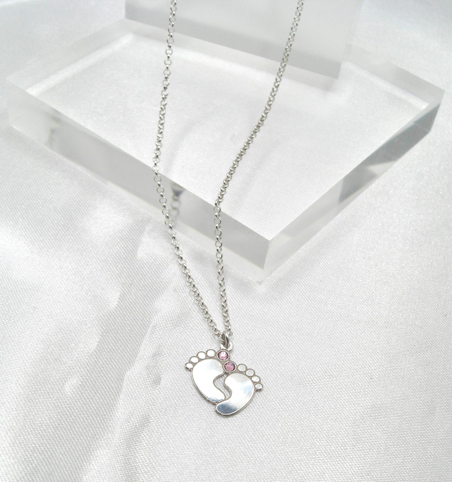 Collana in argento con piede neonato