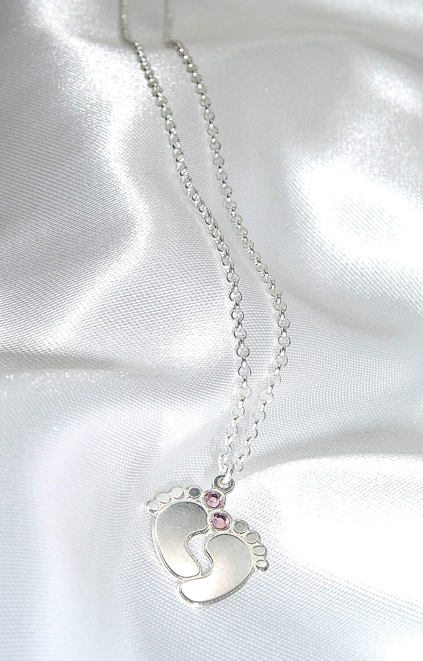 Collana in argento con piede neonato