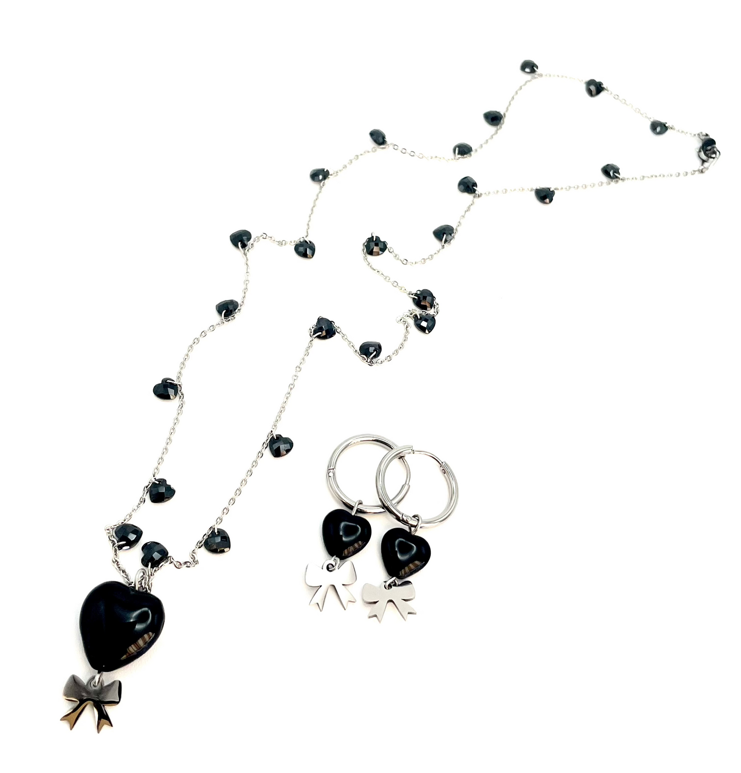 Collana e orecchini in acciaio con fiocco