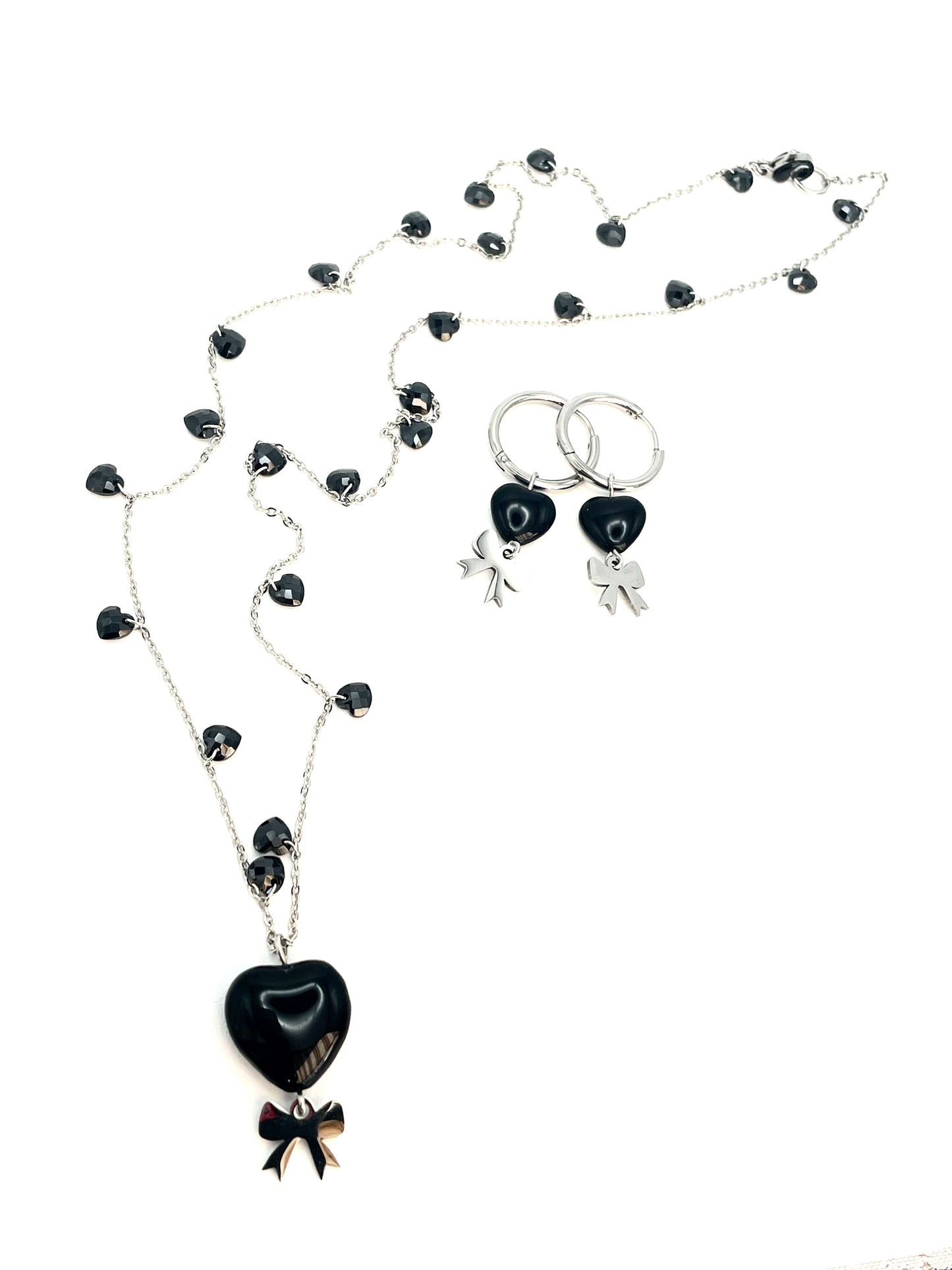 Collana e orecchini in acciaio con fiocco
