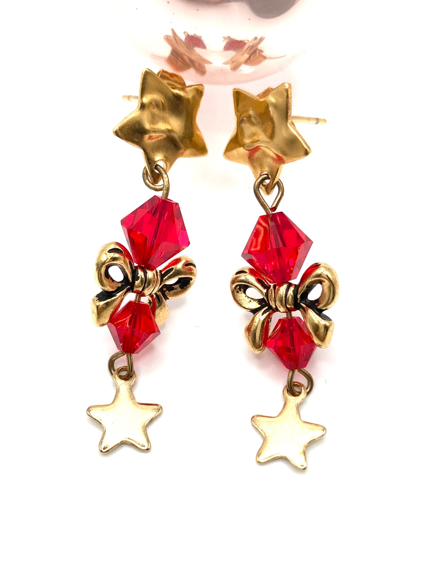 Orecchini con fiocco e stellina